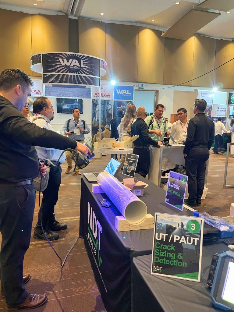 Engineer demonstrating laser scanner during a pipeline inspection demo.