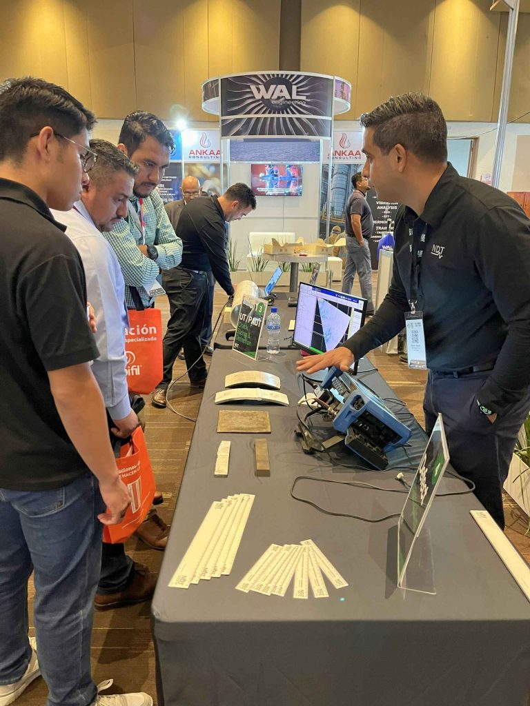 Engineer performing PAUT demonstration for event attendees.